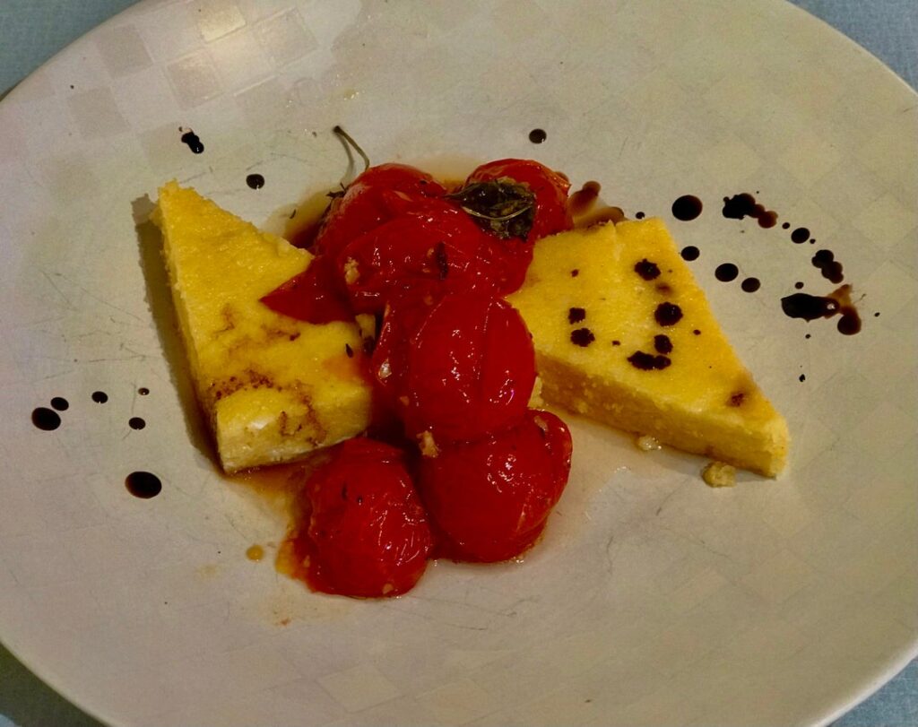 Roasted garlic/ goat cheese polenta with balsamic braised Campari tomatoes
