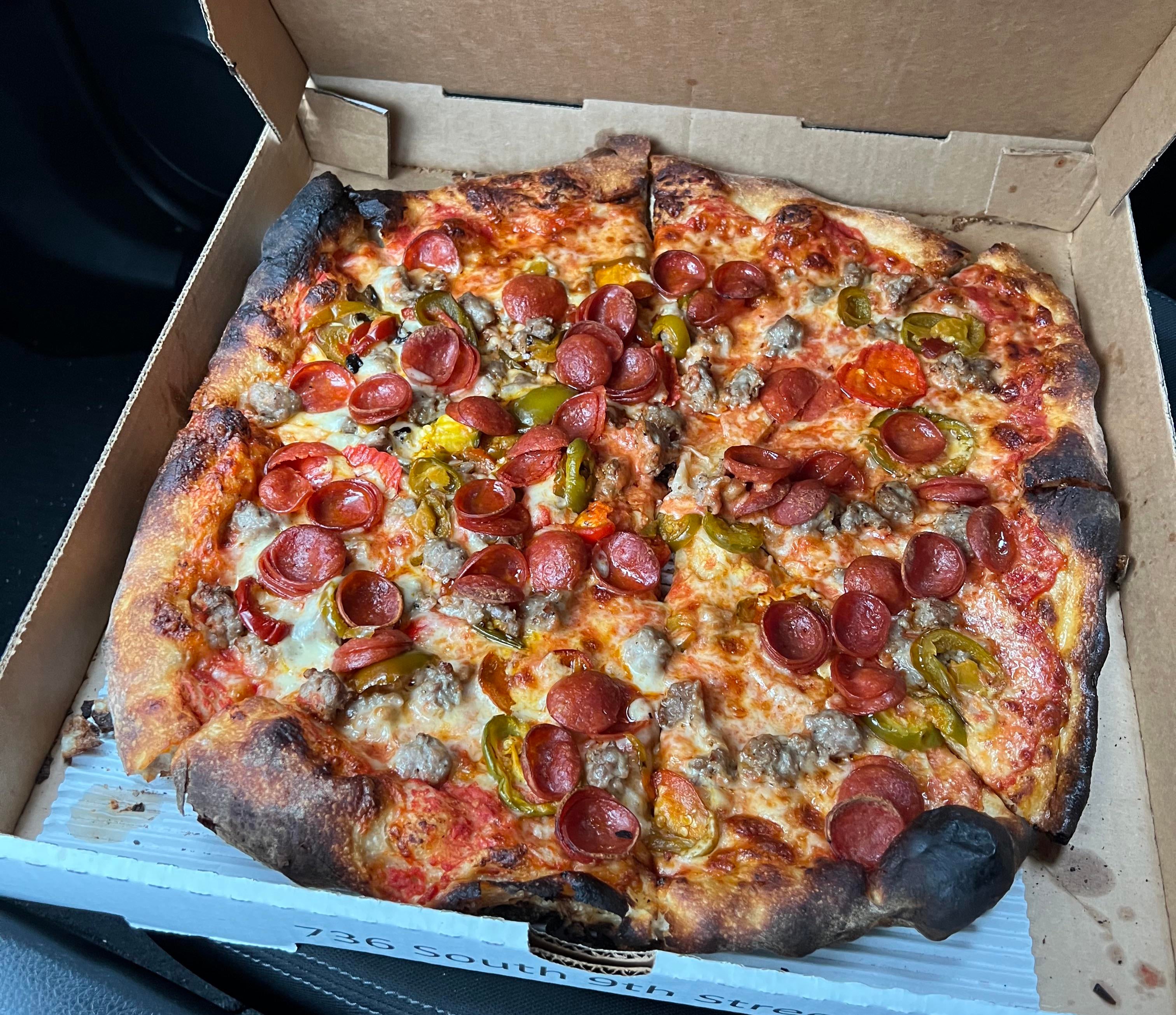 Pizza with pepperoni, sausage, and cherry peppers Dining and Cooking