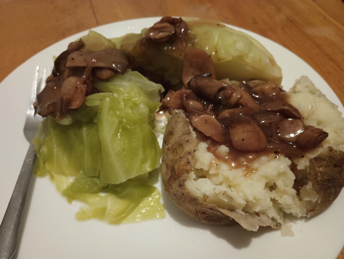 Boiled cabbage, potato, and mushroom gravy