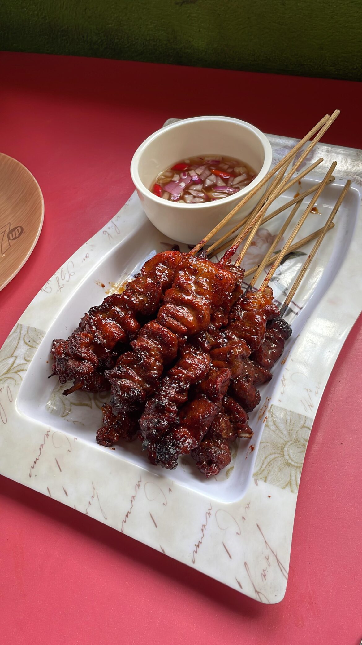 BBQ pork with vinegar dip in San Jose, Batangas.
