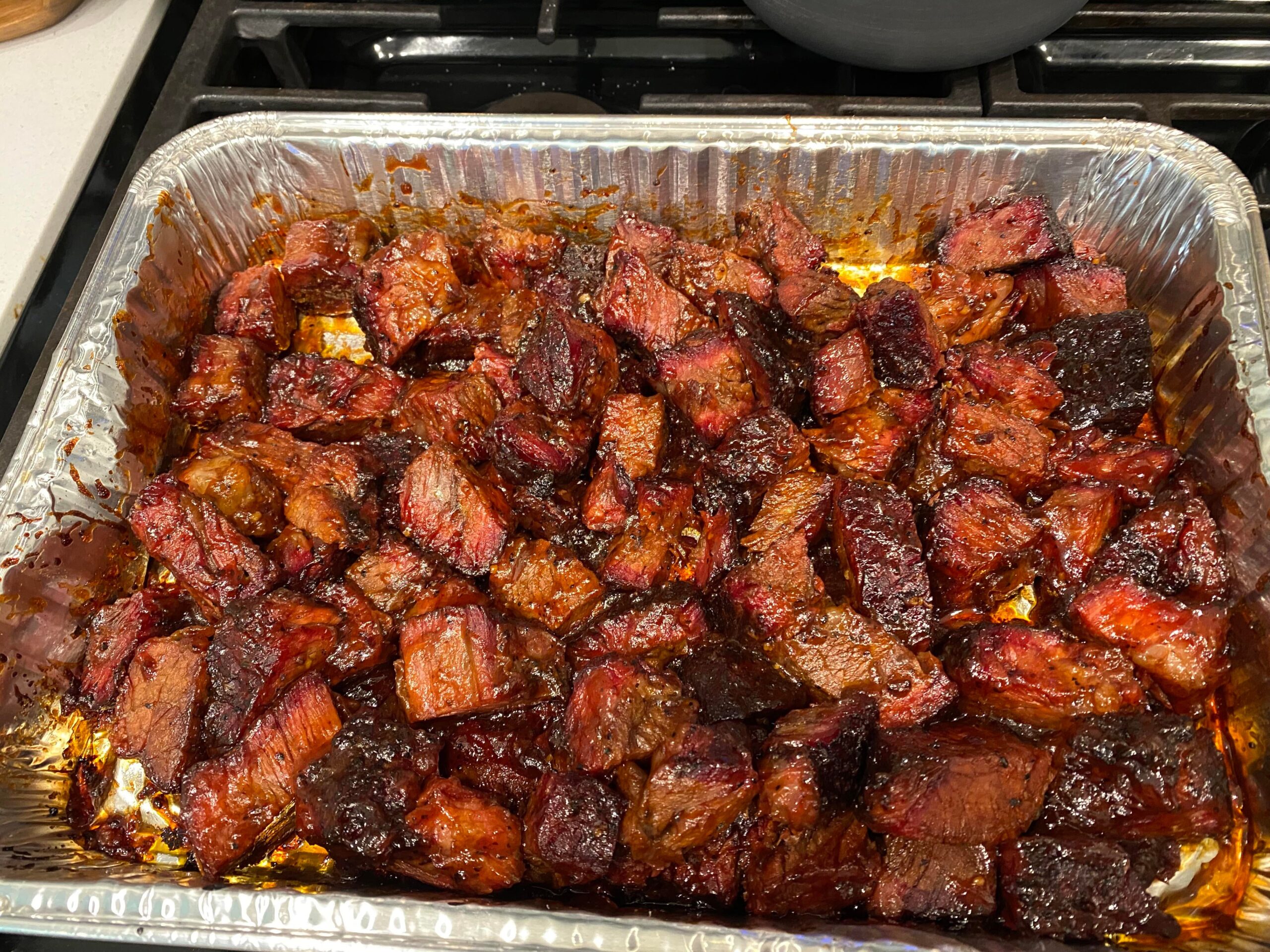 Poor man’s “burnt ends” smoked chuck roast and homemade BBQ sauce