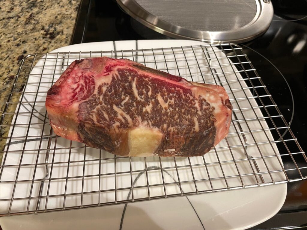 Dry aged bone-in New York strip
