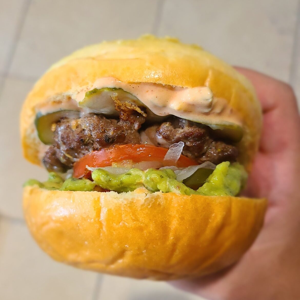 Jalapeño Guacamole Cheeseburger on a brioche bun
