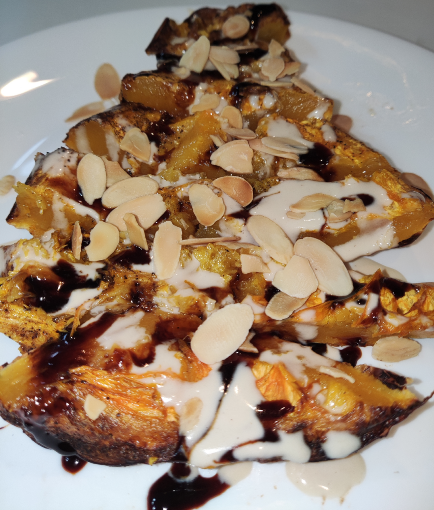 roasted butternut squash with tahini, silan (date syrop) and toasted almonds.