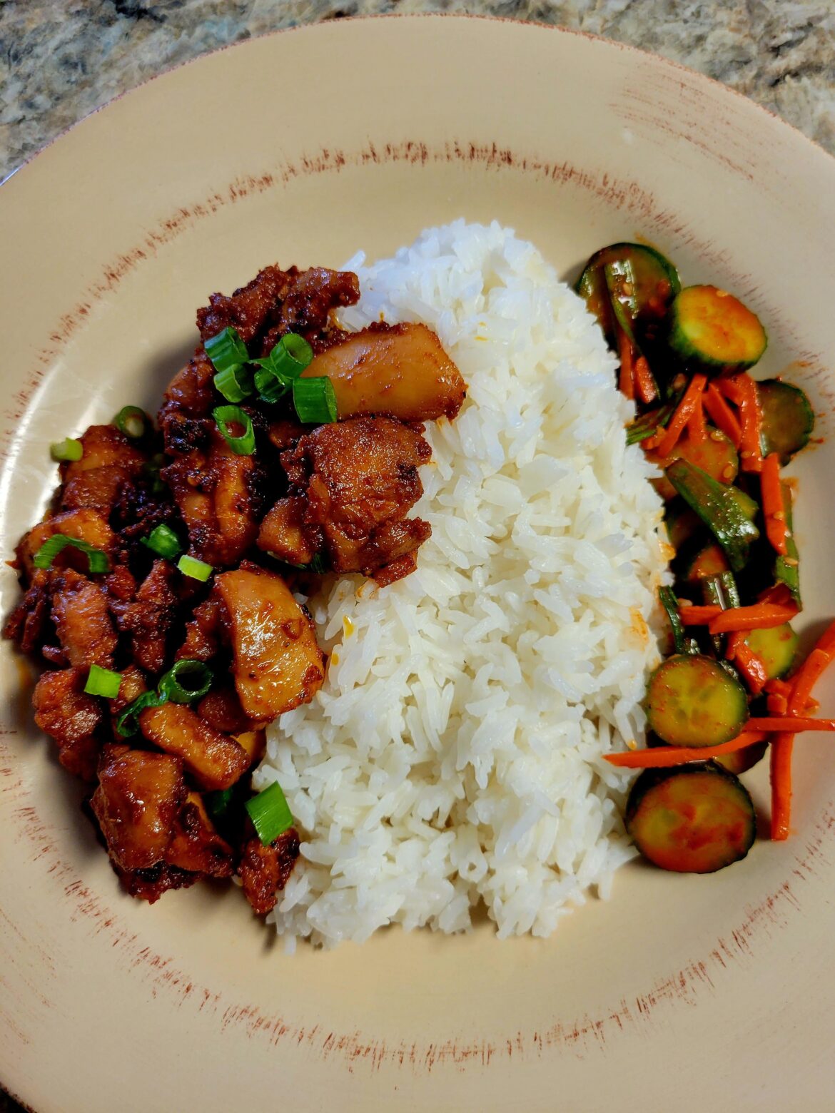 One of my favorite Korean dishes. Spicy chicken bulgogi, cucumber kimchi, and rice