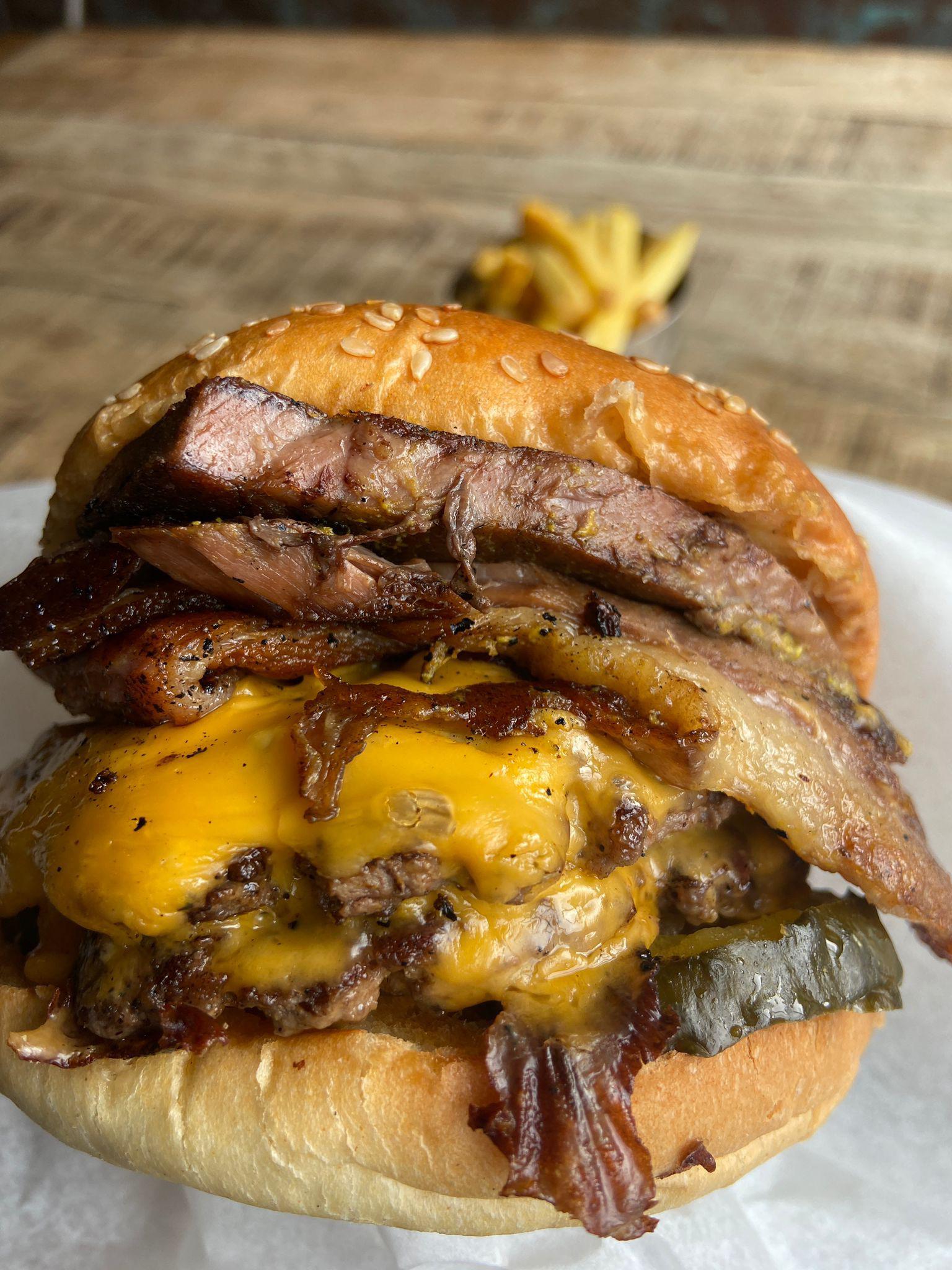 Double smash patty, house smoked beef brisket, bacon, pickles, pickled