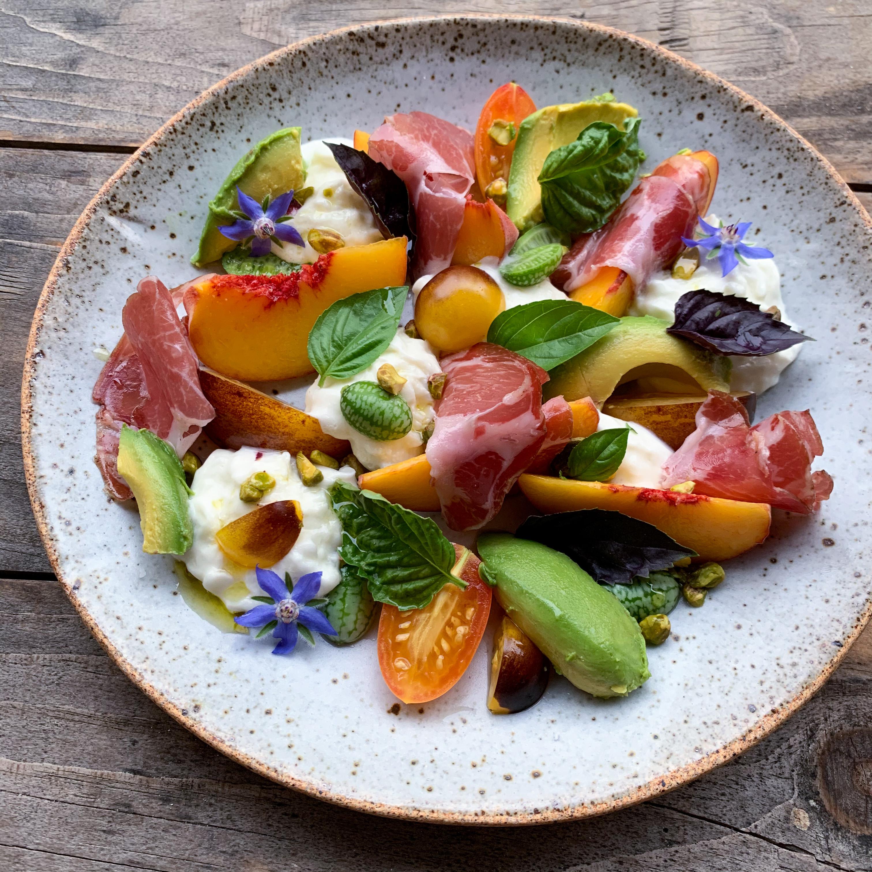 Tomato, peach and burrata salad with prosciutto and avocado Dining
