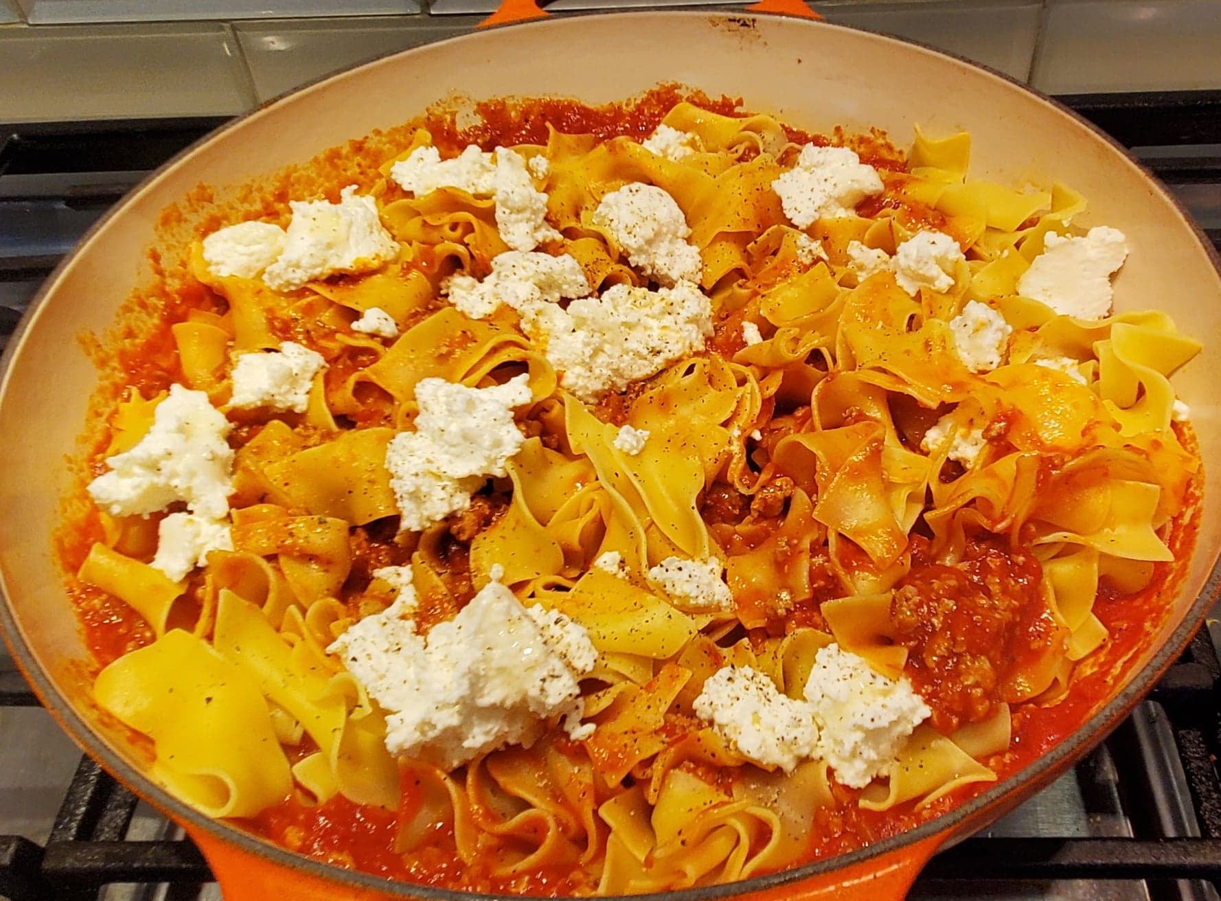Ground chicken tomato pasta finished with dollops of ricotta cheese