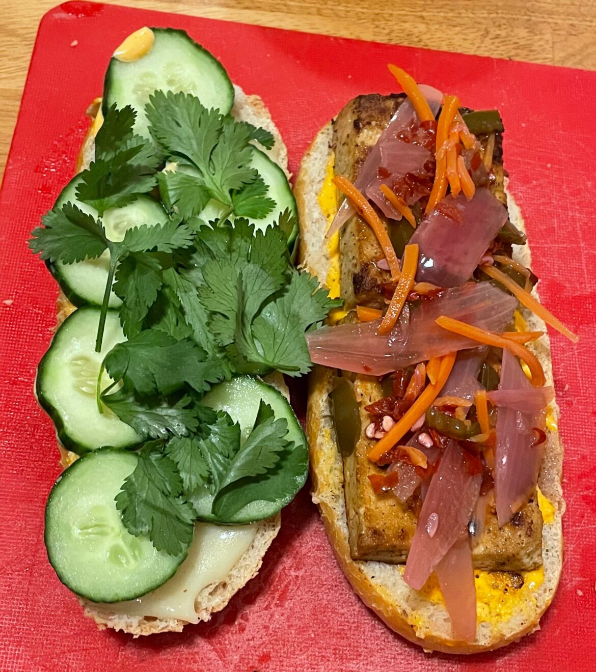 Tofu bánh mì with spicy home-pickled veggies, Sriracha mayo, cilantro, cucumber