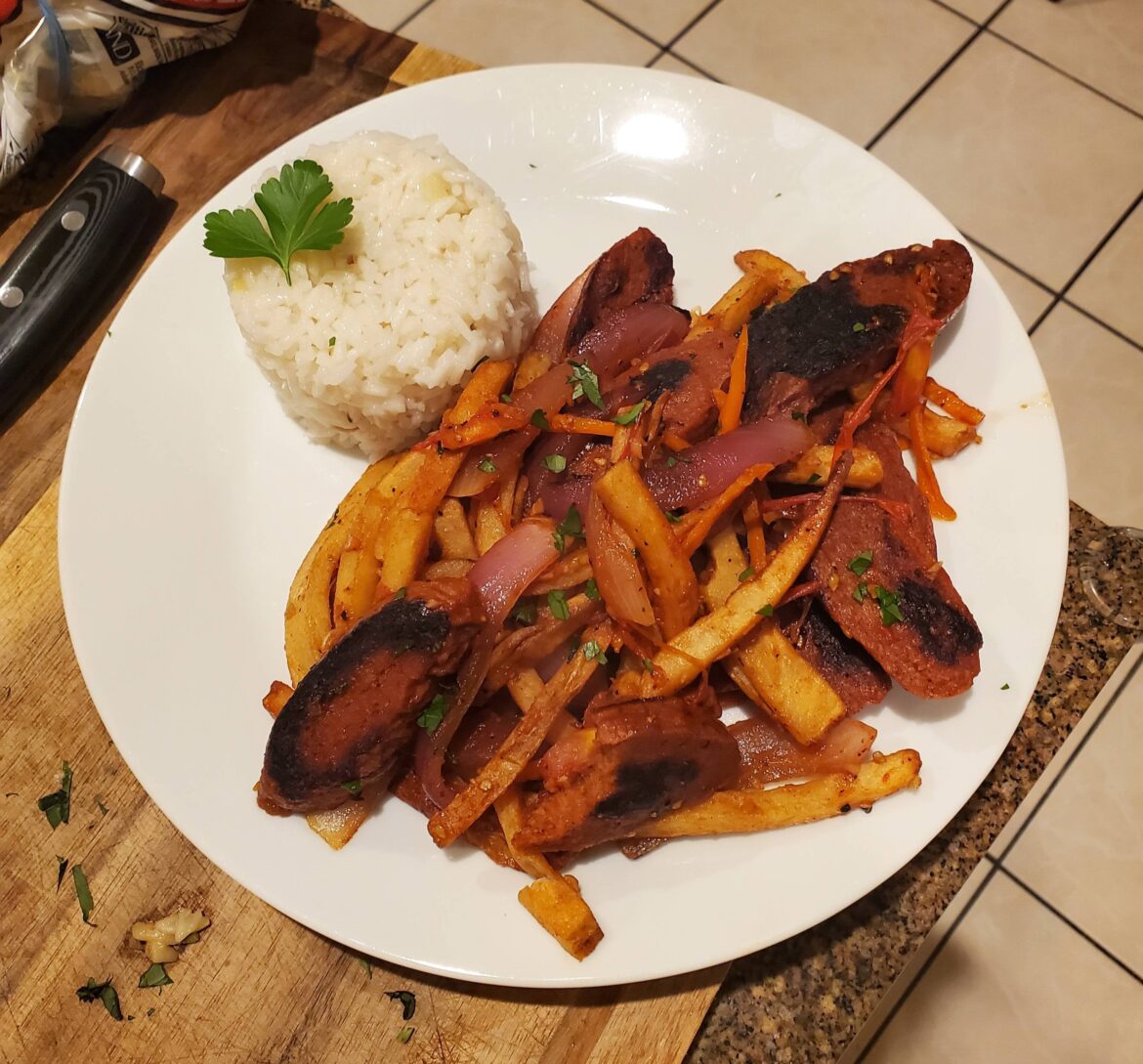Lomo saltado with seitan steak and homegrown ají amarillo peppers
