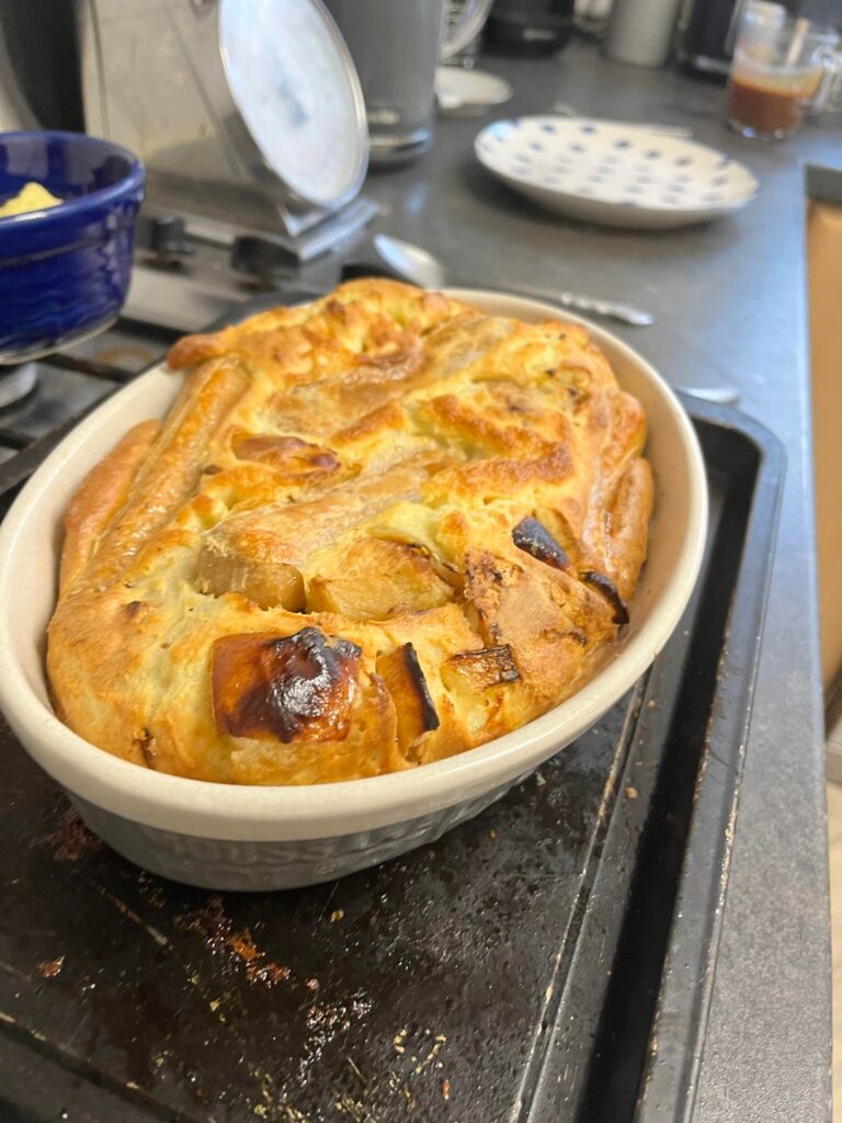 Toad in the hole with vegetarian sausages, cauliflower mash and onion gravy