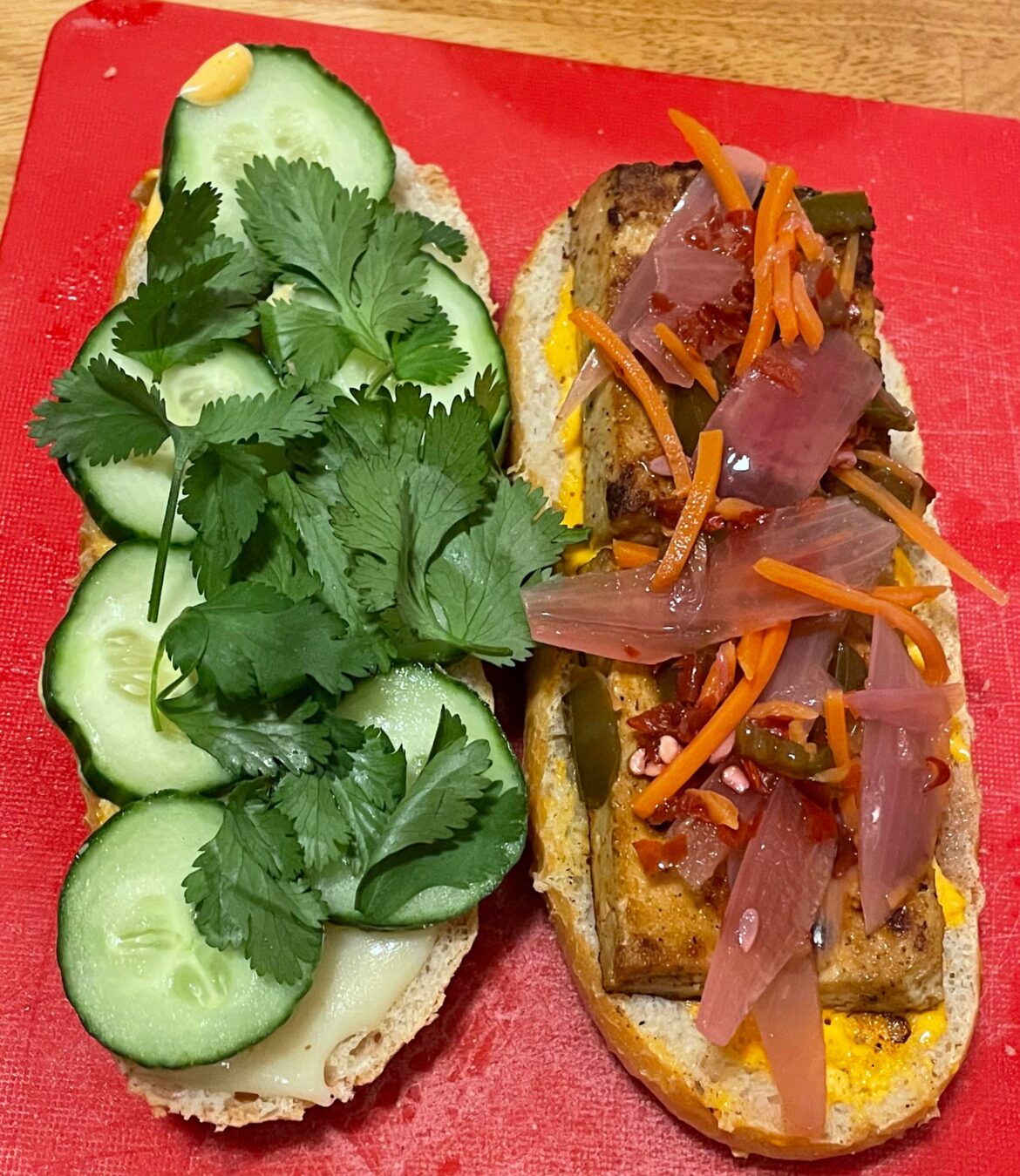 Tofu bánh mì with spicy home-pickled veggies, Sriracha mayo, cilantro, cucumber