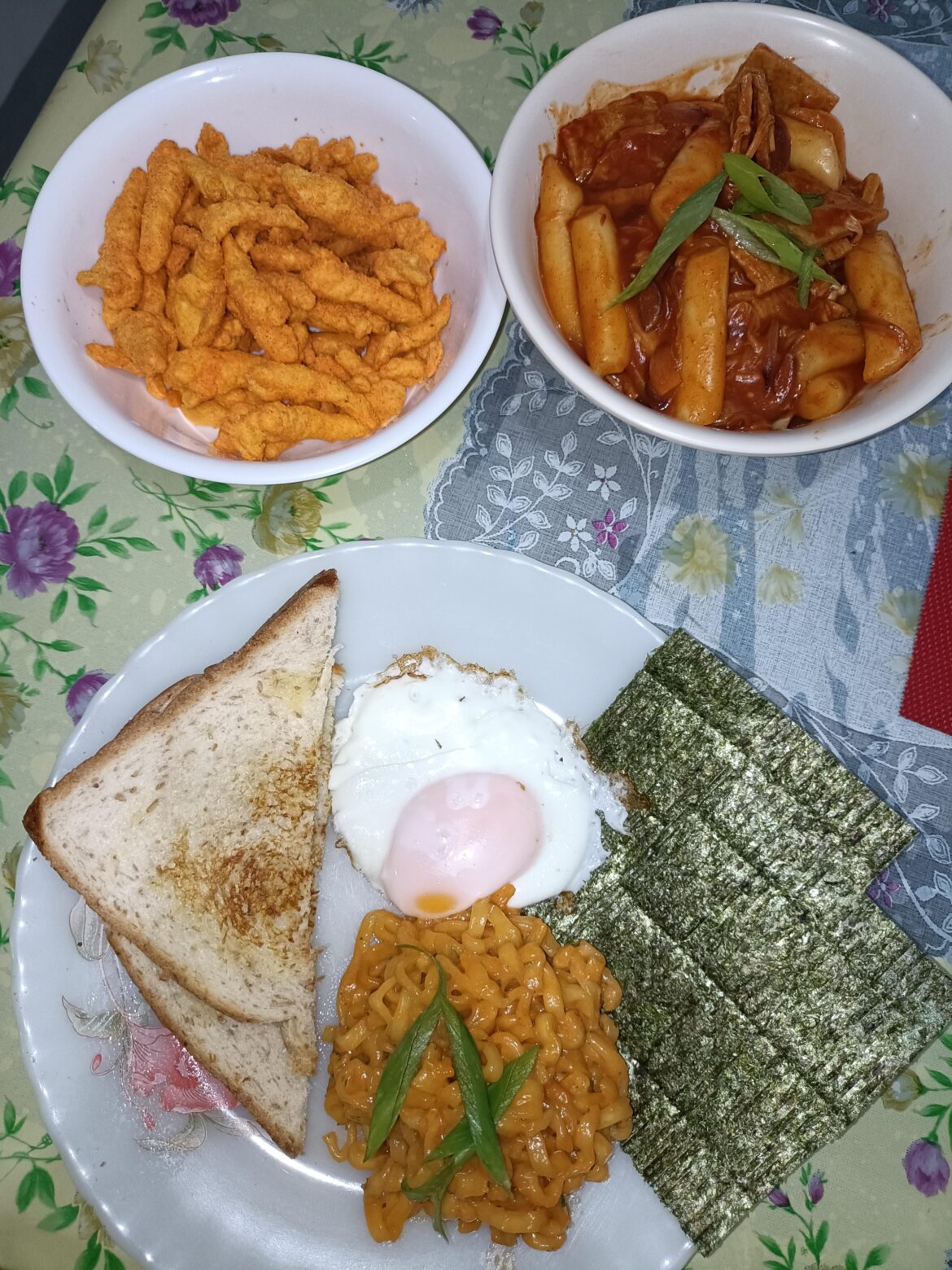 Buldak Creamy Carbonara, Tteokbokki with fish cake and Enoki mushroom, and some local chips