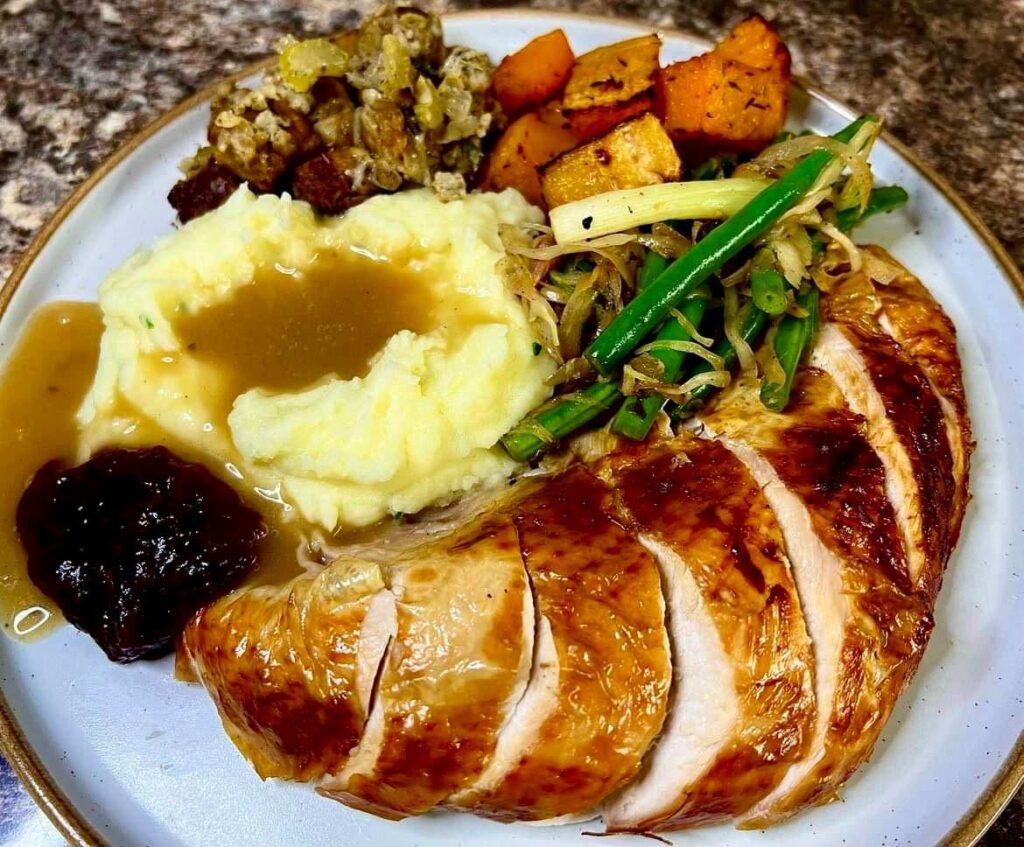 Thanksgiving dinner made by a Brit. . . Crispy skinned turkey, creamy mash, crouton, sausage meat and sage stuffing, roasted butternut squash with a pinch of paprika, warmed spicy green bean, green onion and cabbage salad and cranberry sauce. All made from scratch. Thanksgiving dinner made by a Brit. . . Crispy skinned turkey, creamy mash, crouton, sausage meat and sage stuffing, roasted butternut squash with a pinch of paprika, warmed spicy green bean, green onion and cabbage salad and cranberry sauce. All made from scratch.