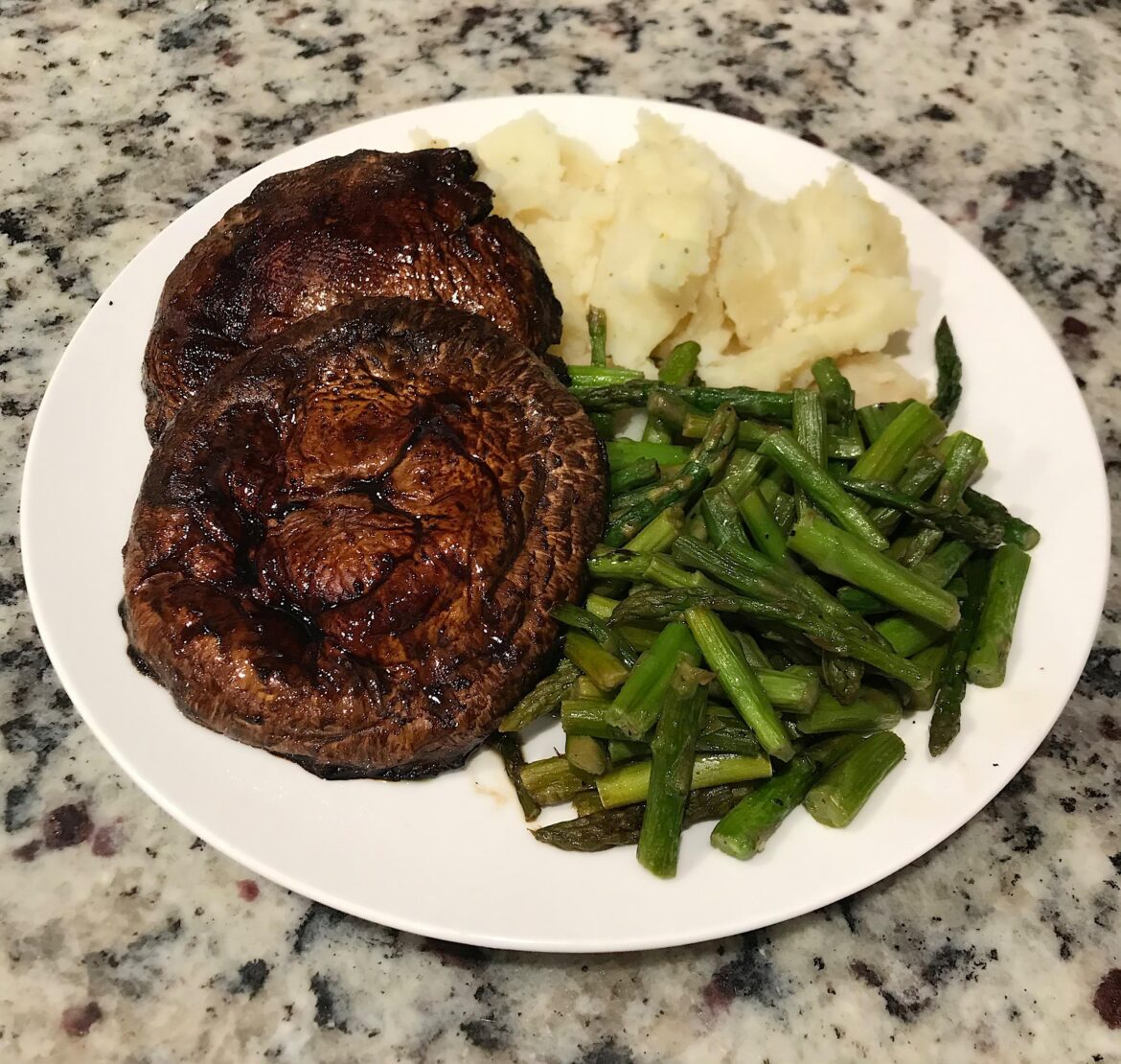 Pan seared portobello in balsamic glaze, garlic herb mashed potatoes and sautéed asparagus for dinner