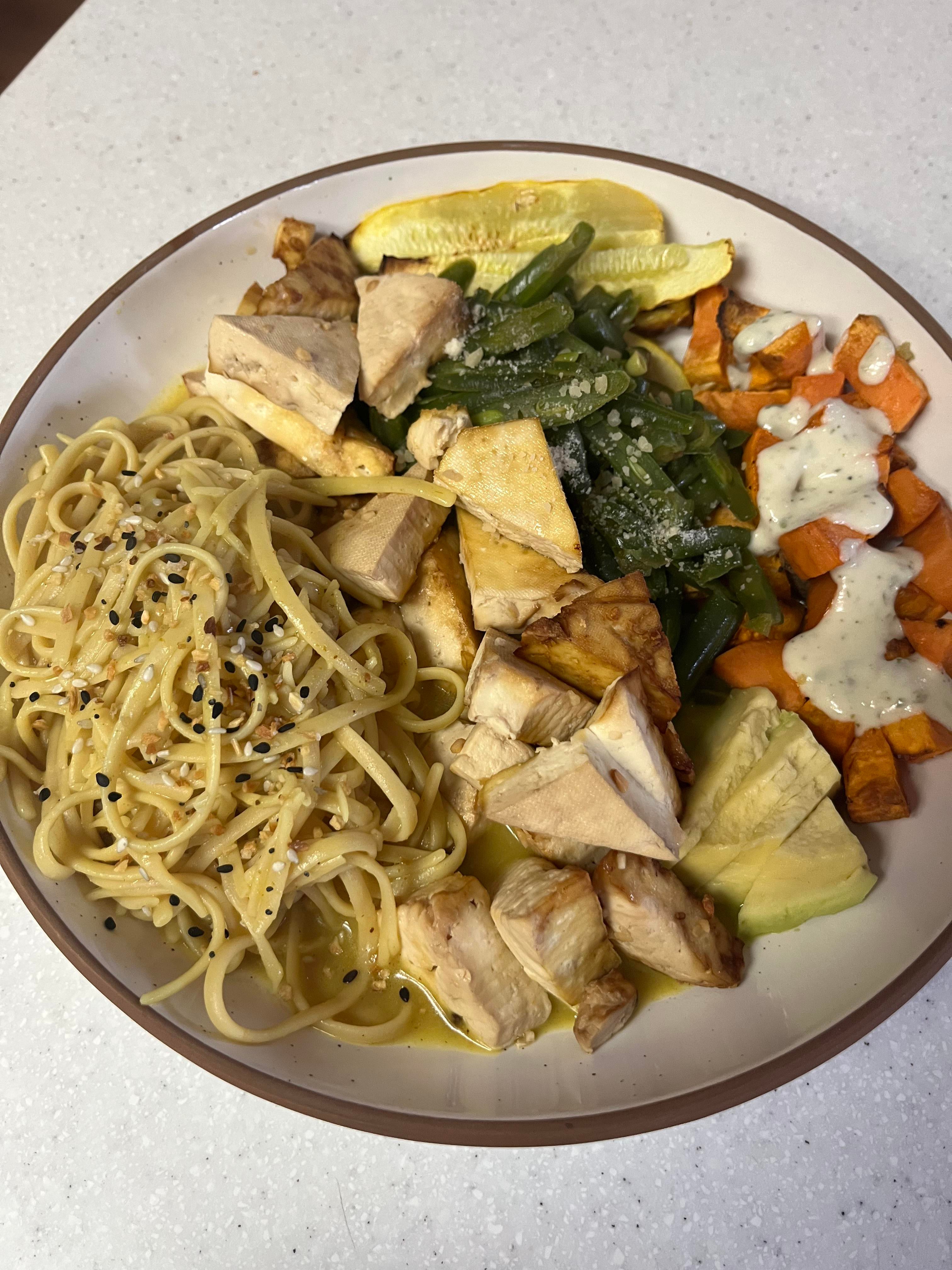 Yellow curry chickpea pasta, air fried tofu, yellow squash, sweet