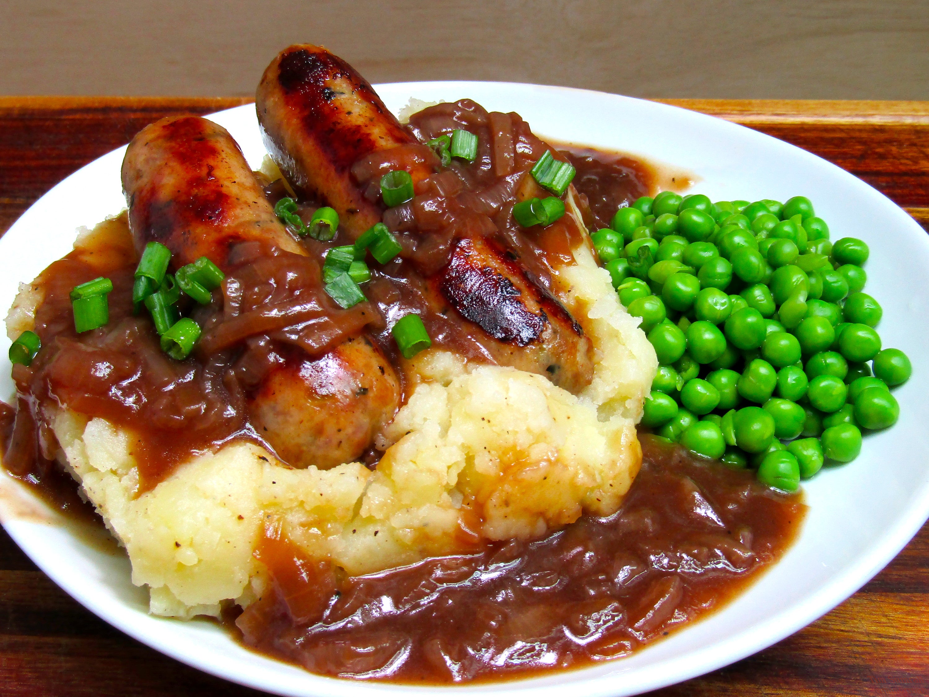 Homemade Bangers And Mash With Onion Gravy And Peas Dining And Cooking homemade-bangers-and-mash-with-onion-gravy-and-peas-dining-and-cooking