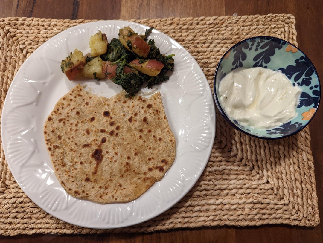 Radish paratha with a potatospinach sabzi and kheer Dining and Cooking