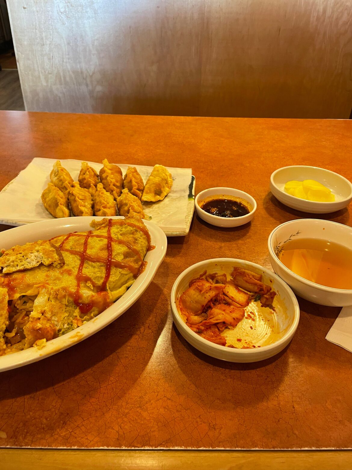 Omelet fried rice, fried dumplings, anchovy soup, kimchi and radishes at Myung Ga Kimbap in Fairfax, VA!