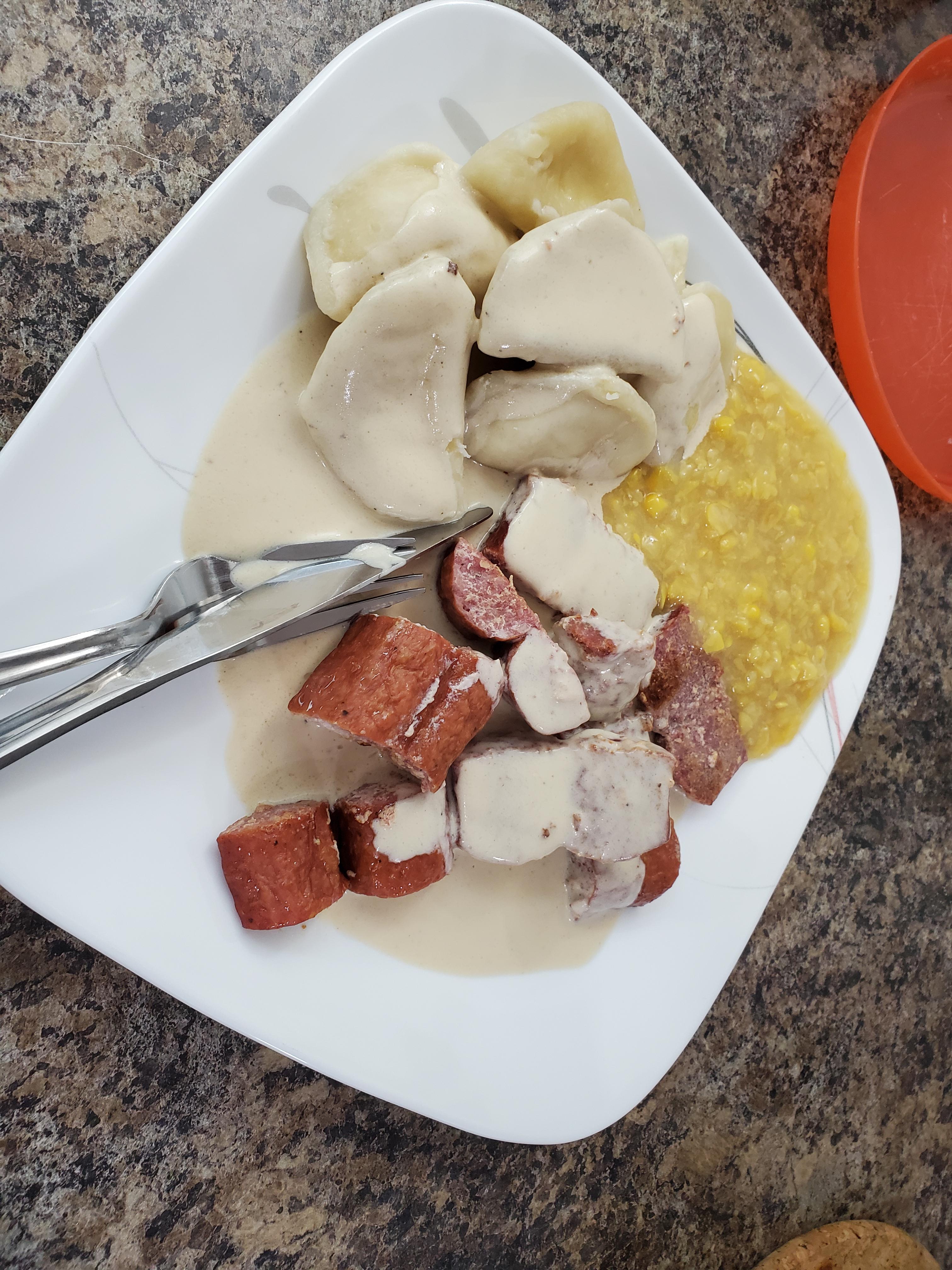 cottage cheese perogies with farmer sausage, cream corn and a sour