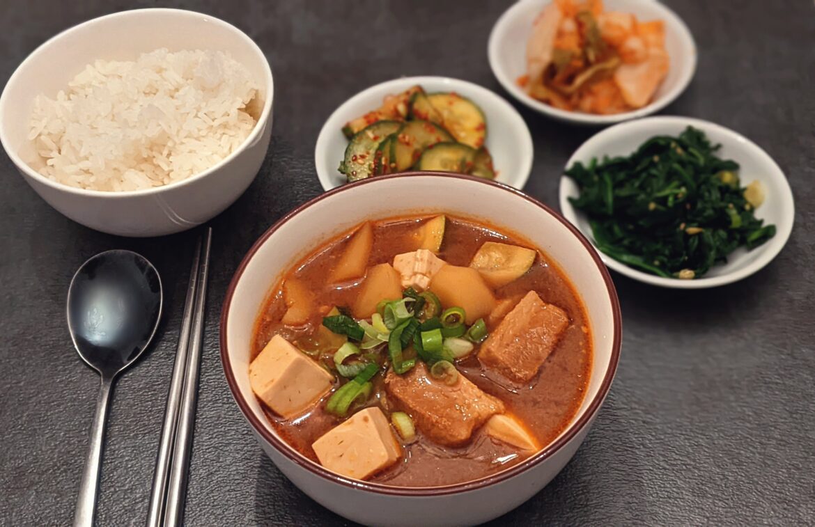Doenjang guk with pork belly. Banchan are kimchi, oi muchim, sigeumchi namul. My kids are all sick and this is the meal they requested.