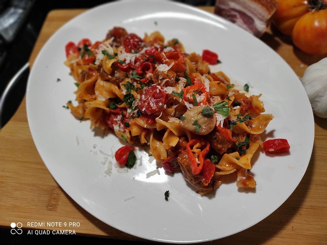 Rotini A'la Vodka with Spicy Sausage and Confit Tomatoes. Dining and
