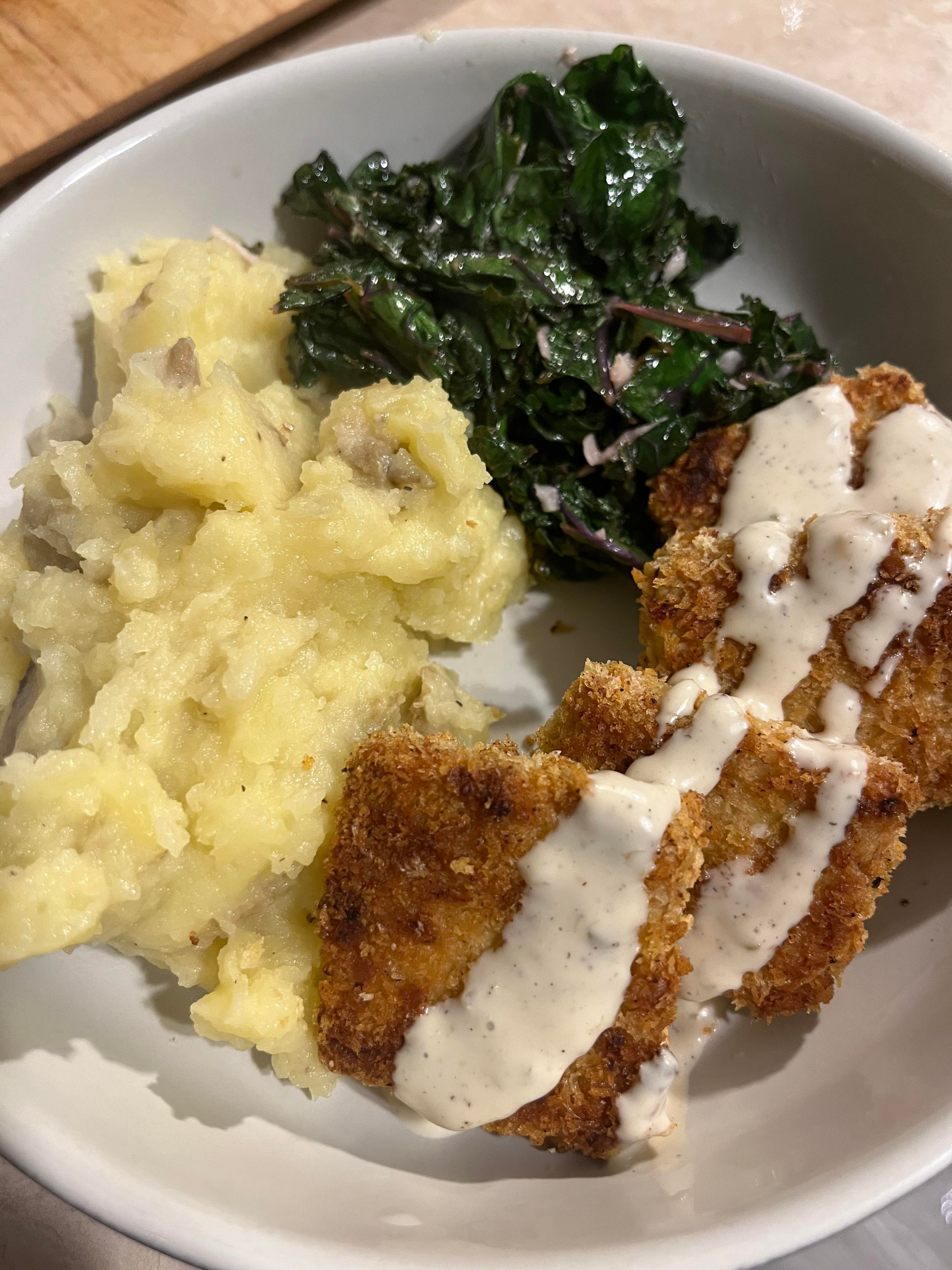 Breaded tofu w/ Caesar dressing, mashed potatoes & garlicky sautéed