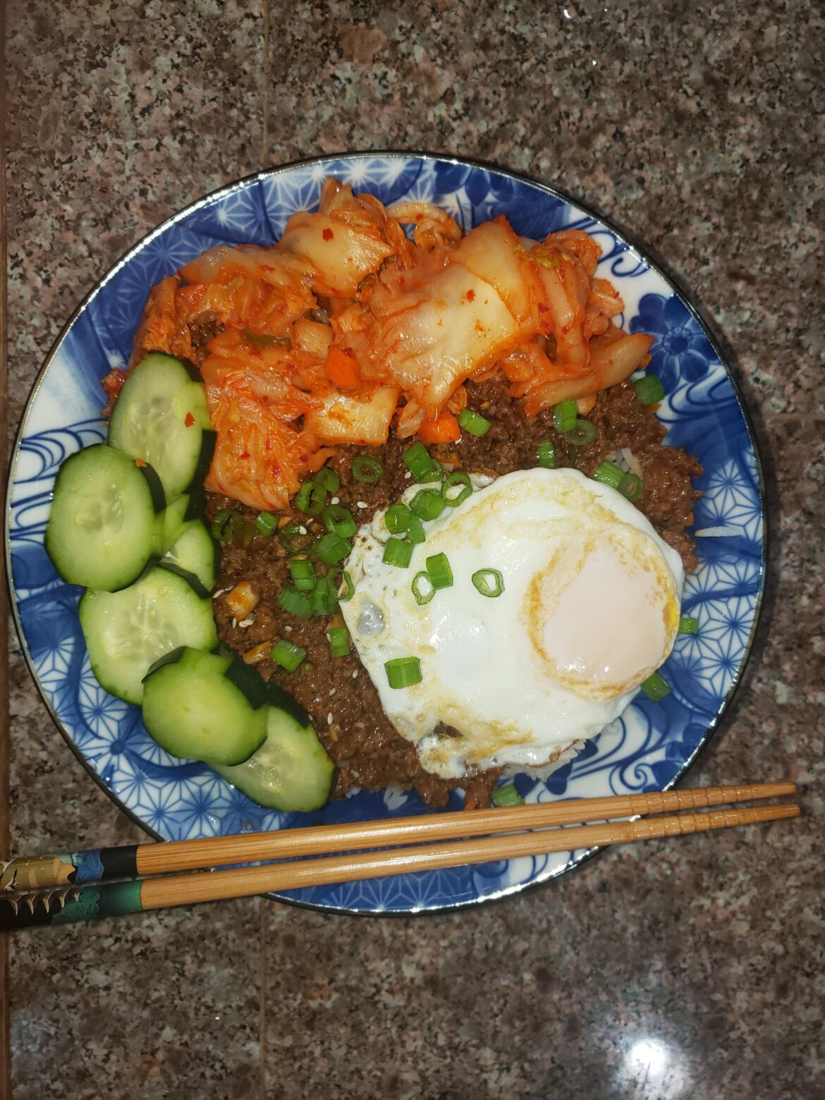 Ground beef and rice bowl, kind of a bulgogi spin off with kimchi and cucumber. It's the first Korean dish I've made alone. This was the recipe I used-https://mykoreankitchen.com/korean-ground-beef-rice-bowls/#more-22442