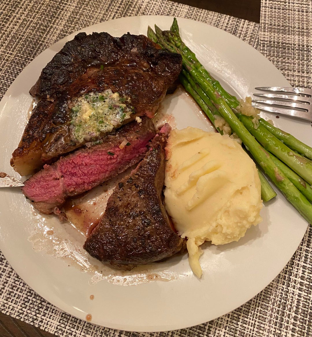 [homemade] My attempt at reverse seared ribeye with compound butter