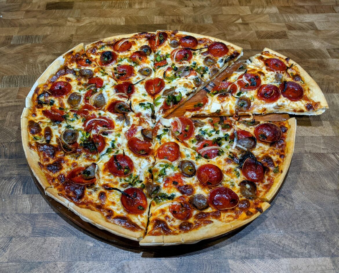 Thin & crispy w/ pepperoni, Italian sausage, poblano chiles and onion.