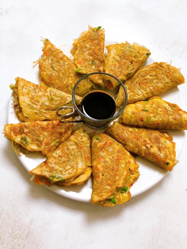 Egg Dumplings Dalgyal Mandu- delicious Korean folded egg dumplings made from egg, carrots, onion and glass noodles.