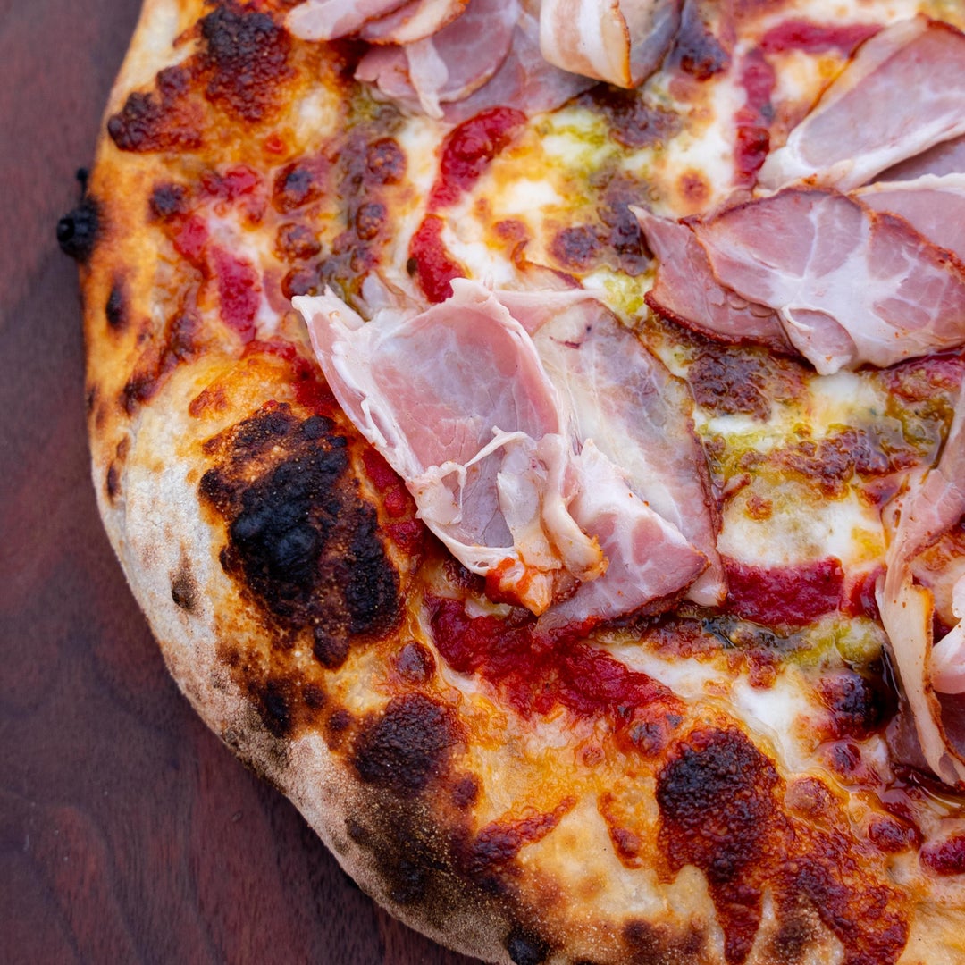 Sourdough Pizza w/ Spicy Capicollo, Homemade Basil Pesto, & Red Sauce