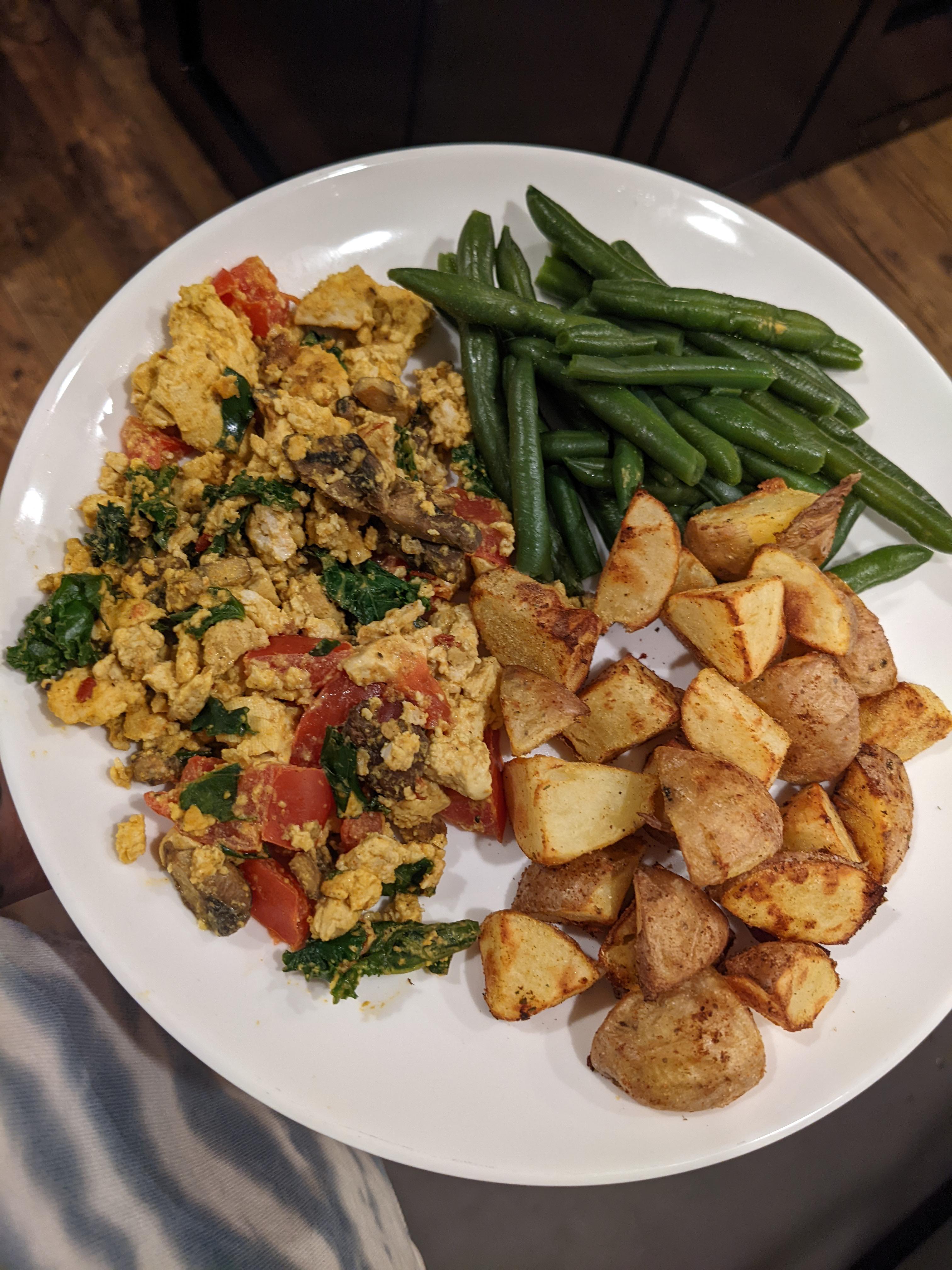 Tofu scramble courtesy of rainbowplantlife and air fried potatoes with green beans. Dining and