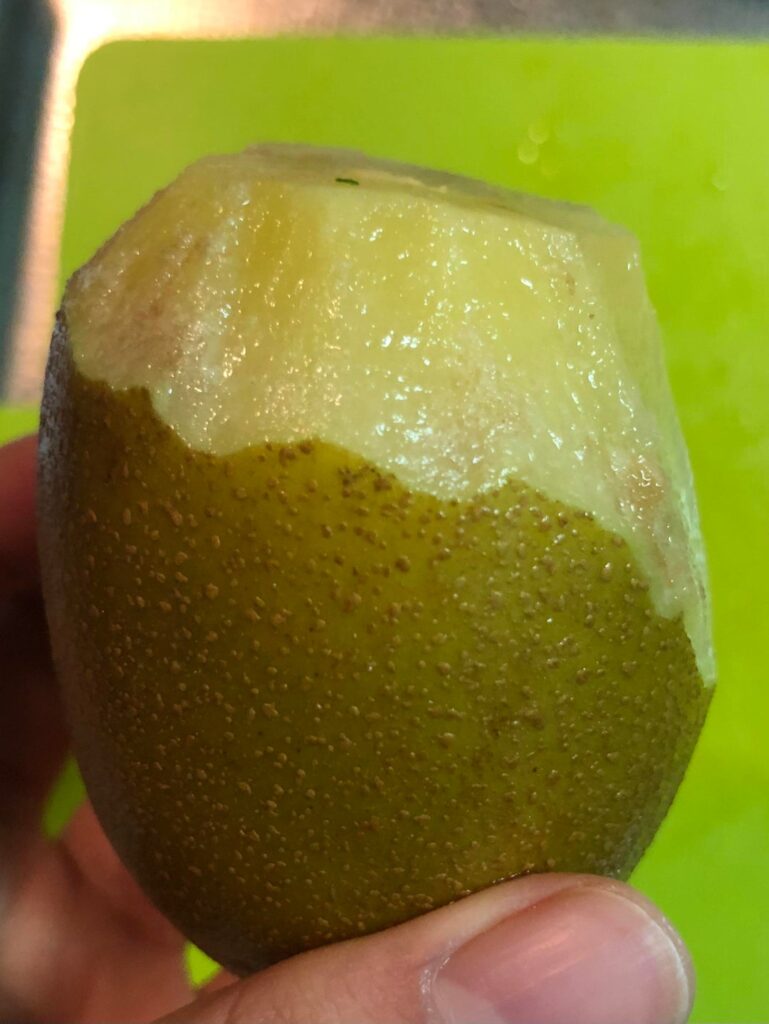 Sorry if this is a wrong place to ask, but is this gold kiwi spoiled? I have no idea what those brown-ish spots are. The kiwi smells normal though.