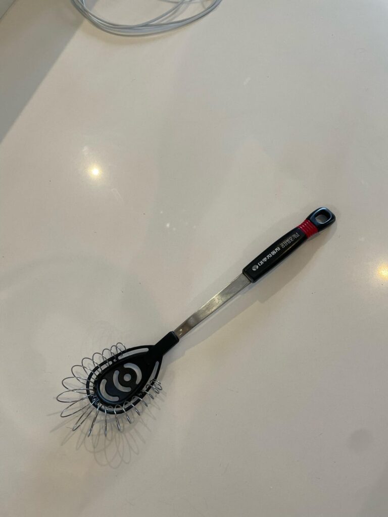 Can anyone tell me the full purpose of this? I bought it at a 2nd hand store. I was guessing whisking eggs, but can’t figure out what the middle black part is for. I tried google searching but kept getting a hairbrush.