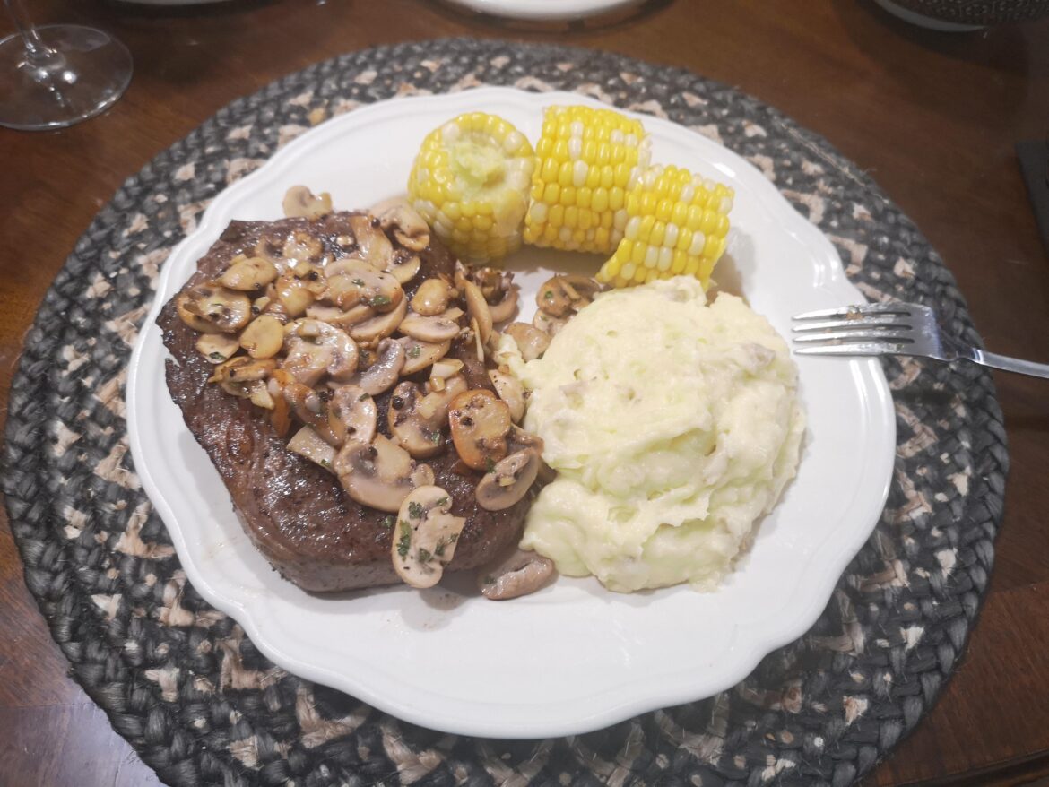Sous vide ribeye at 136 for 3 hours and 1 minute a side on a red hot grill. With garlic mash and corn.