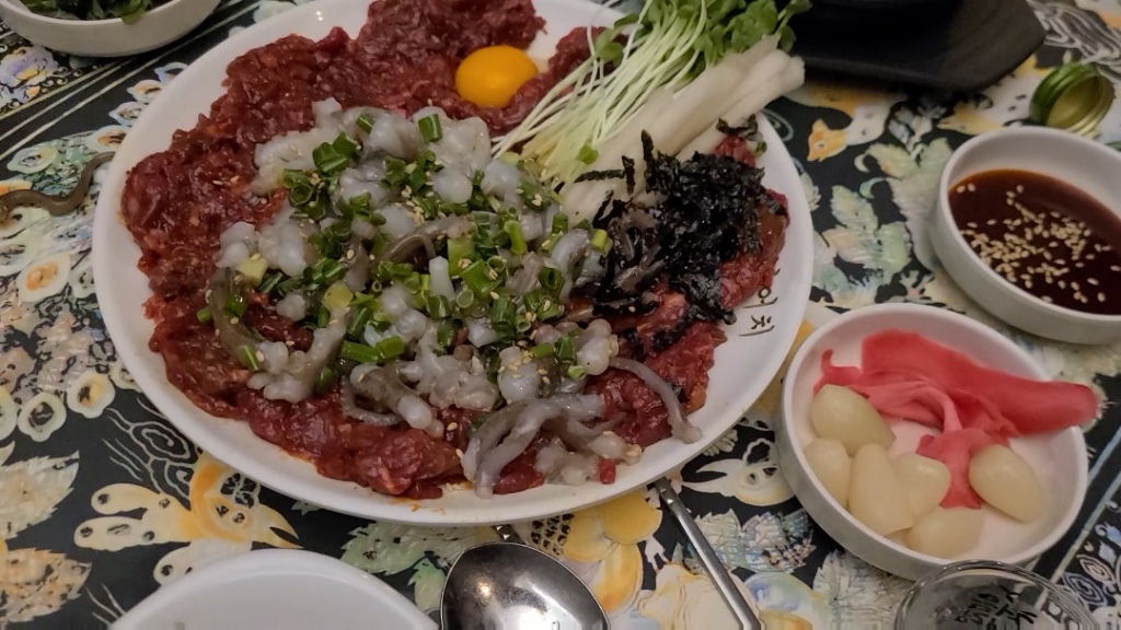 I Had Raw squid on Raw beef with a Raw egg in Korea! It's really delicious if you don't judge it too harshly