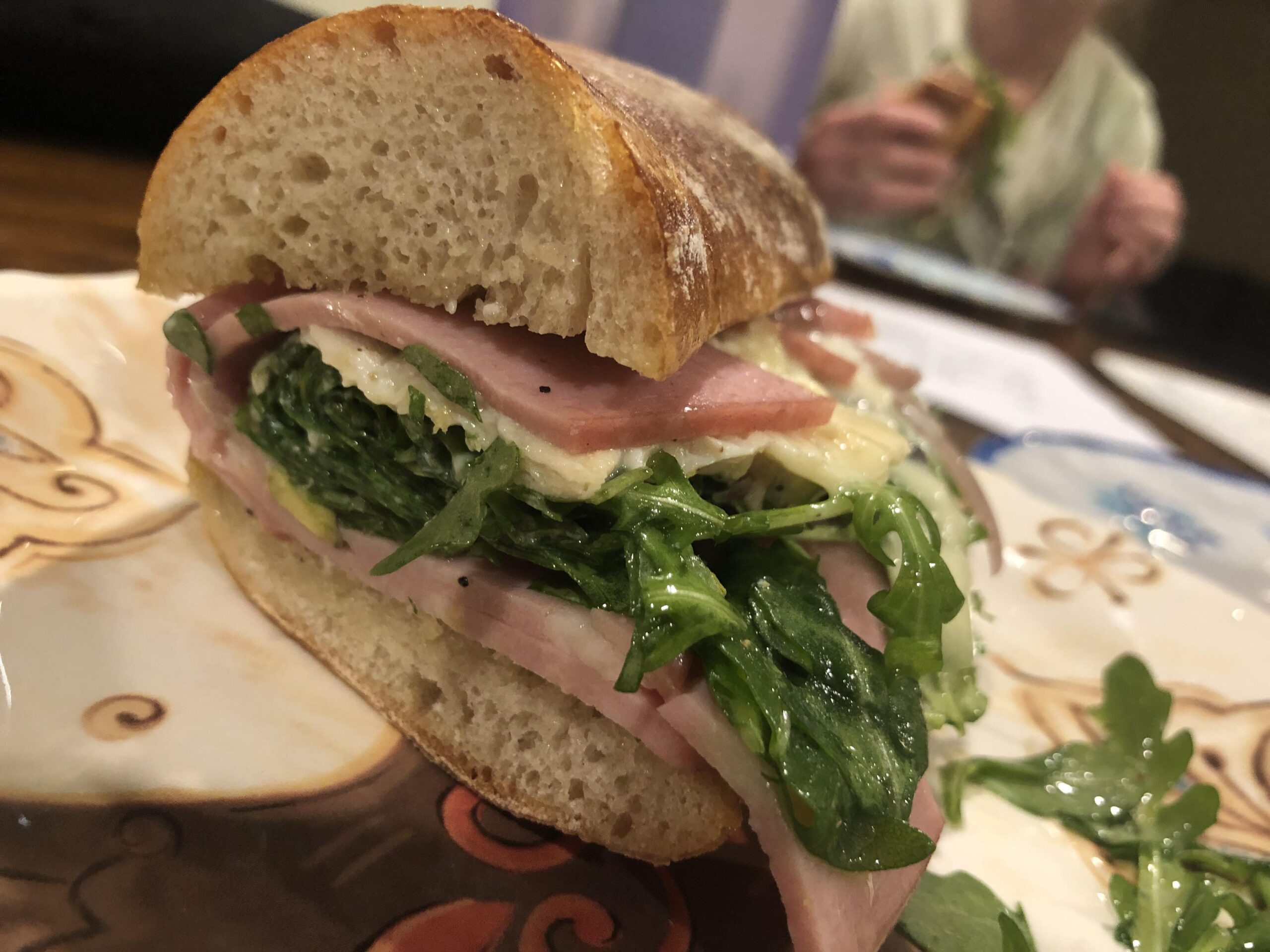 Mortadella, arugula and Bucheron cheese on mini baguette Dining and