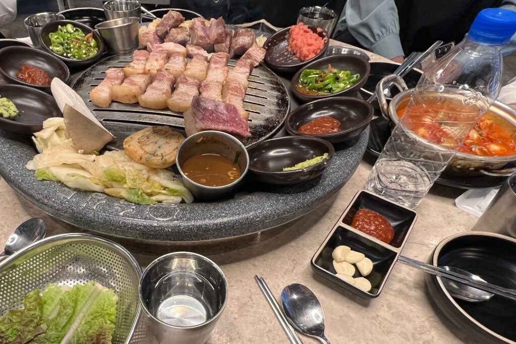 Samgyeopsal (삼겹살) and all of the accouterments... including friends.