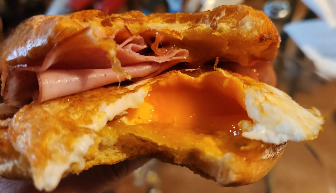 Brioche, Cheddar, 2 Fried Eggs, Ham, Maple Syrup