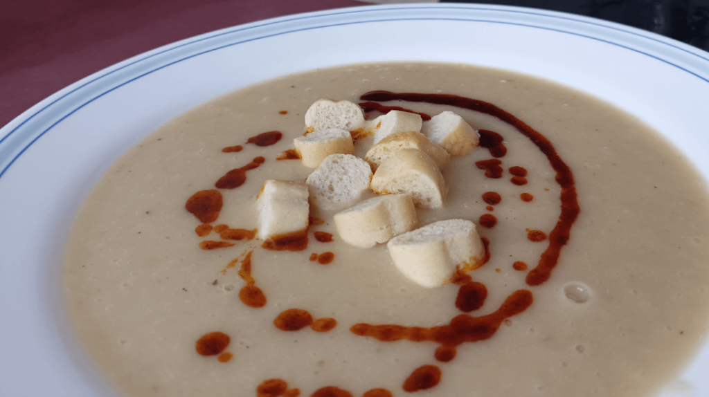 Leek and white bean cream with smoked paprika oil and croutons