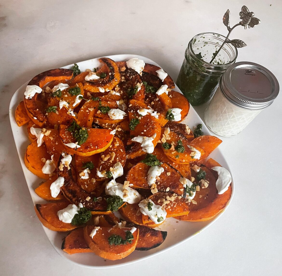 Roasted Butternut Squash with Lemon Garlic Yogurt, Toasted Walnuts, and Spiced Green Sauce