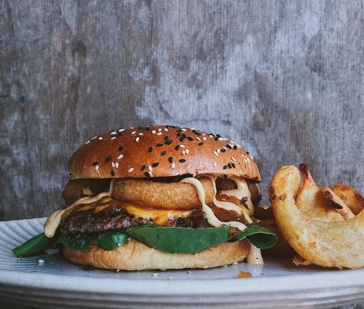80/20 brisket chuck beef patty, double American cheese, bacon jam, cos lettuce, Pilsner beer battered onion rings, bbq mayo, toasted potato bun