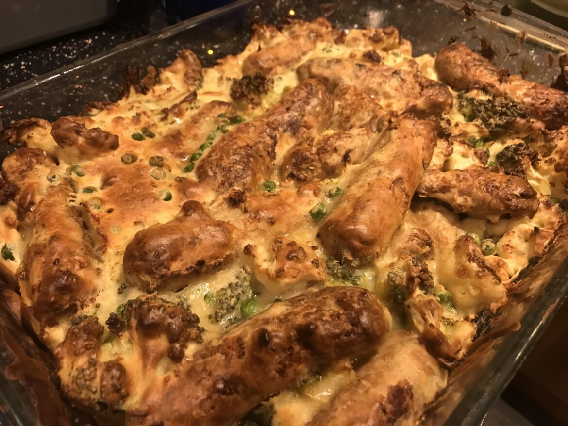Chunky vegetarian Toad in the hole (veg sausage, broccoli, cauliflower & peas)
