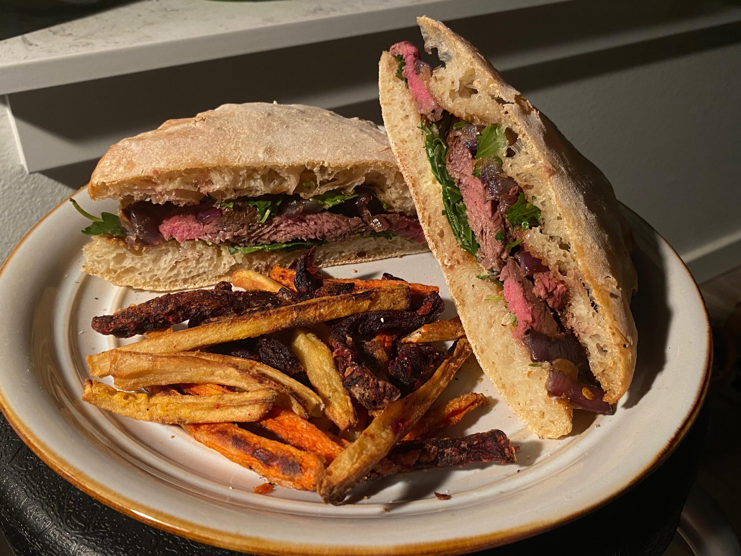 Hanger steak sandwich on homemade ciabatta, with horseradish aioli