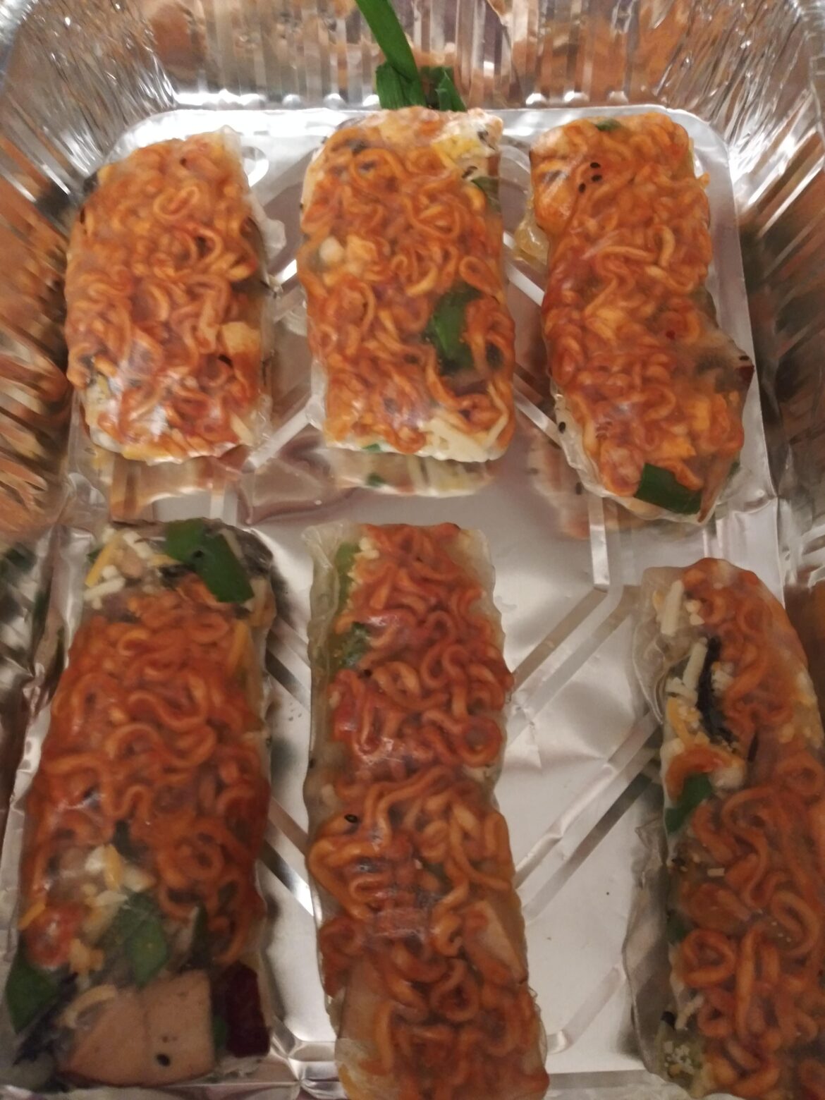 I made spring rolls using Buldak Ramen cheese flavor as part of the filling! Details in comments