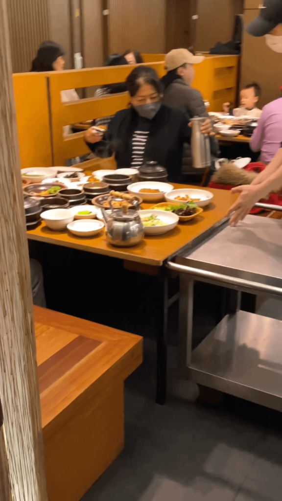 The waiter brings and serves an entire table top