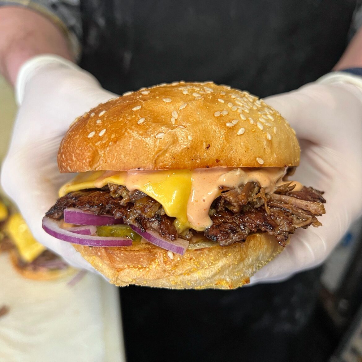 Brisket burger. Brisket, ground beef, American cheese, a little pimento cheese, burger sauce, red onion, pickle. Incredible bun.