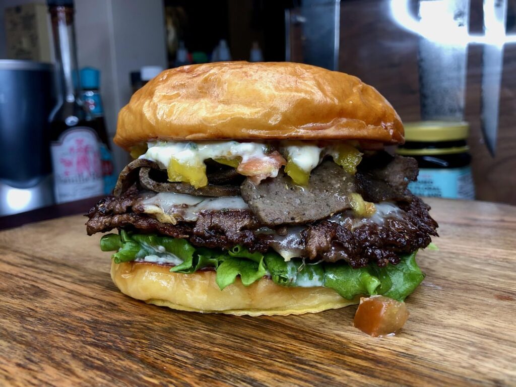 My gyro inspired burger. Two smash patties from home ground beef, Havarti, homemade gyro meat, homemade tzatziki mixed with my jalapeño maple sauce, and a quick relish of tomatoes, red onion, and sweet and spicy banana peppers, on a homemade milk bread bun. My gyro inspired burger. Two smash patties from home ground beef, Havarti, homemade gyro meat, homemade tzatziki mixed with my jalapeño maple sauce, and a quick relish of tomatoes, red onion, and sweet and spicy banana peppers, on a homemade milk bread bun.