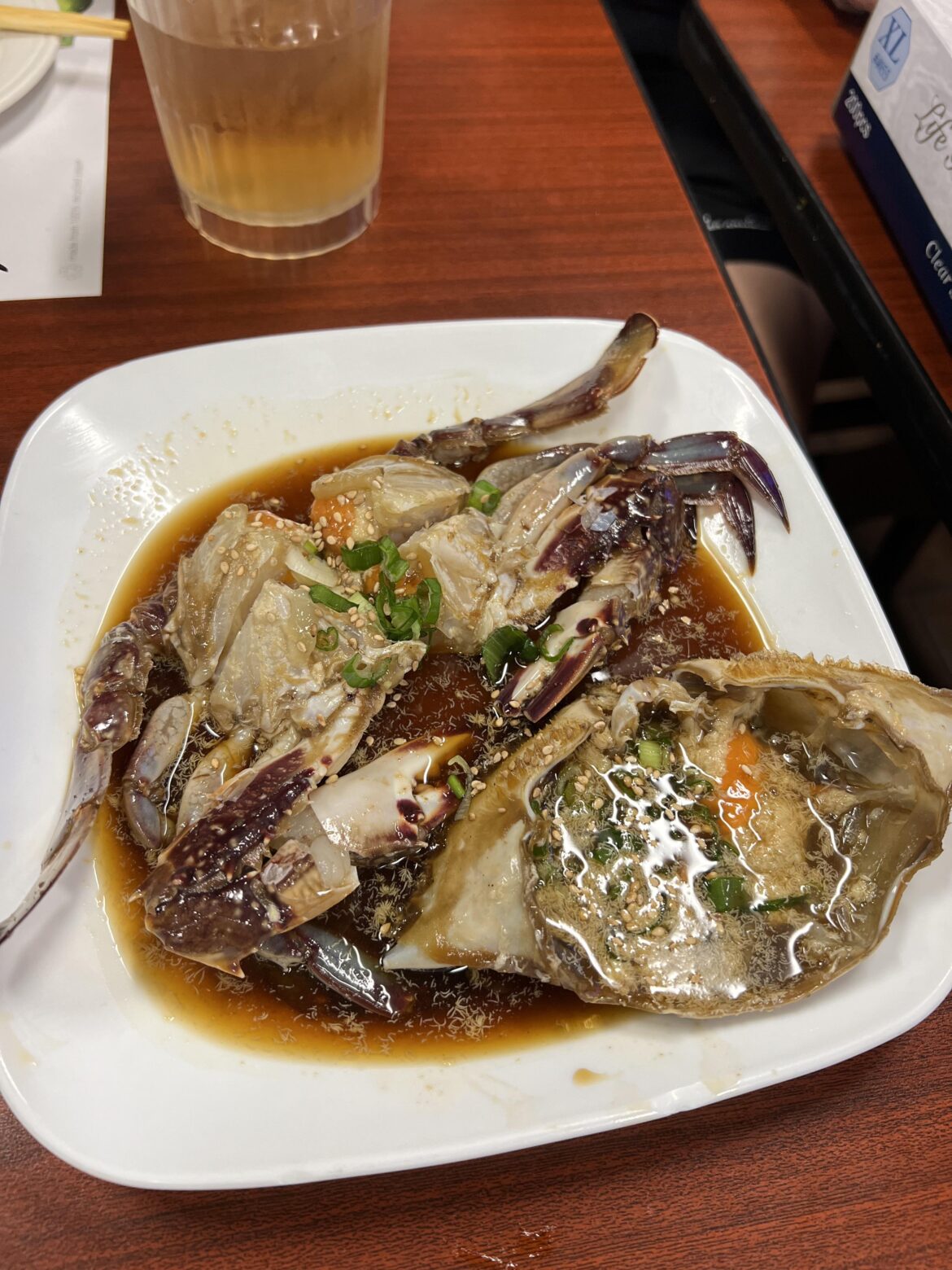 Is this raw marinated crab infected with parasites? See those bug-like white floaters?